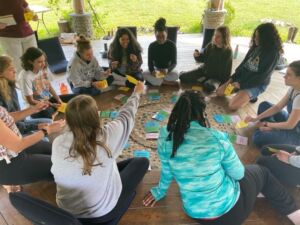 Diverse circle of students gather for activities.